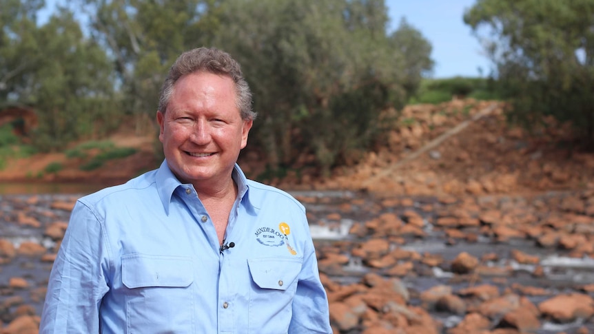 Andrew "Twiggy" Forrest stands in front of the upside-down weir he has developed beneath the Ashburton River on Minderoo