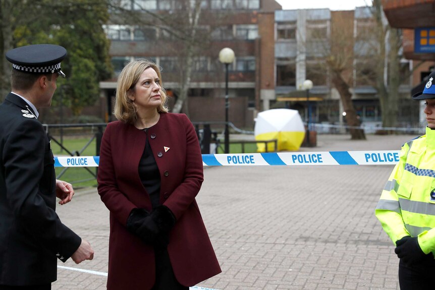Amber Rudd stands in front of a police tape blocking off the scene where Sergei Skripal was found after being poisoned