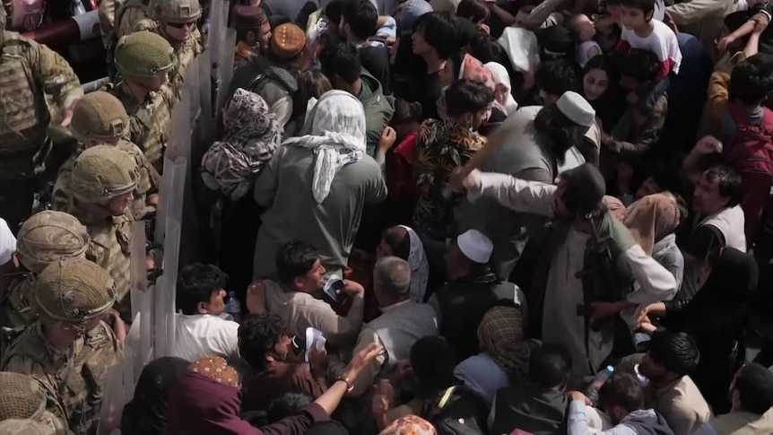 Afghans continue to mass at Kabul airport