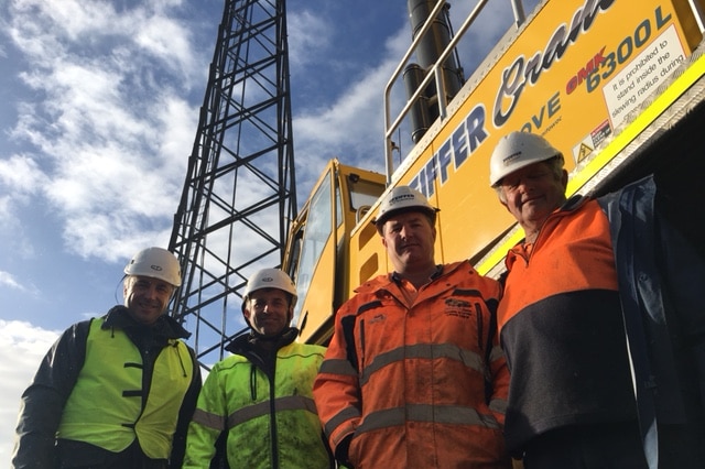 Four men in fluoro vests