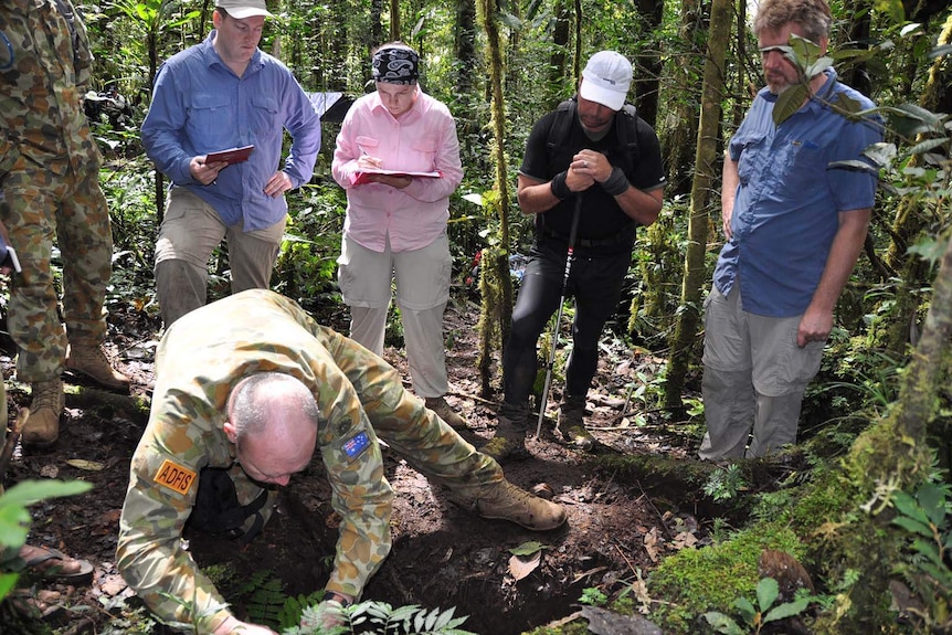A soldier seeking the remains of a fallen WWI soldier in PNG