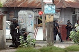 Police patrol the streets of Kingston, Jamaica