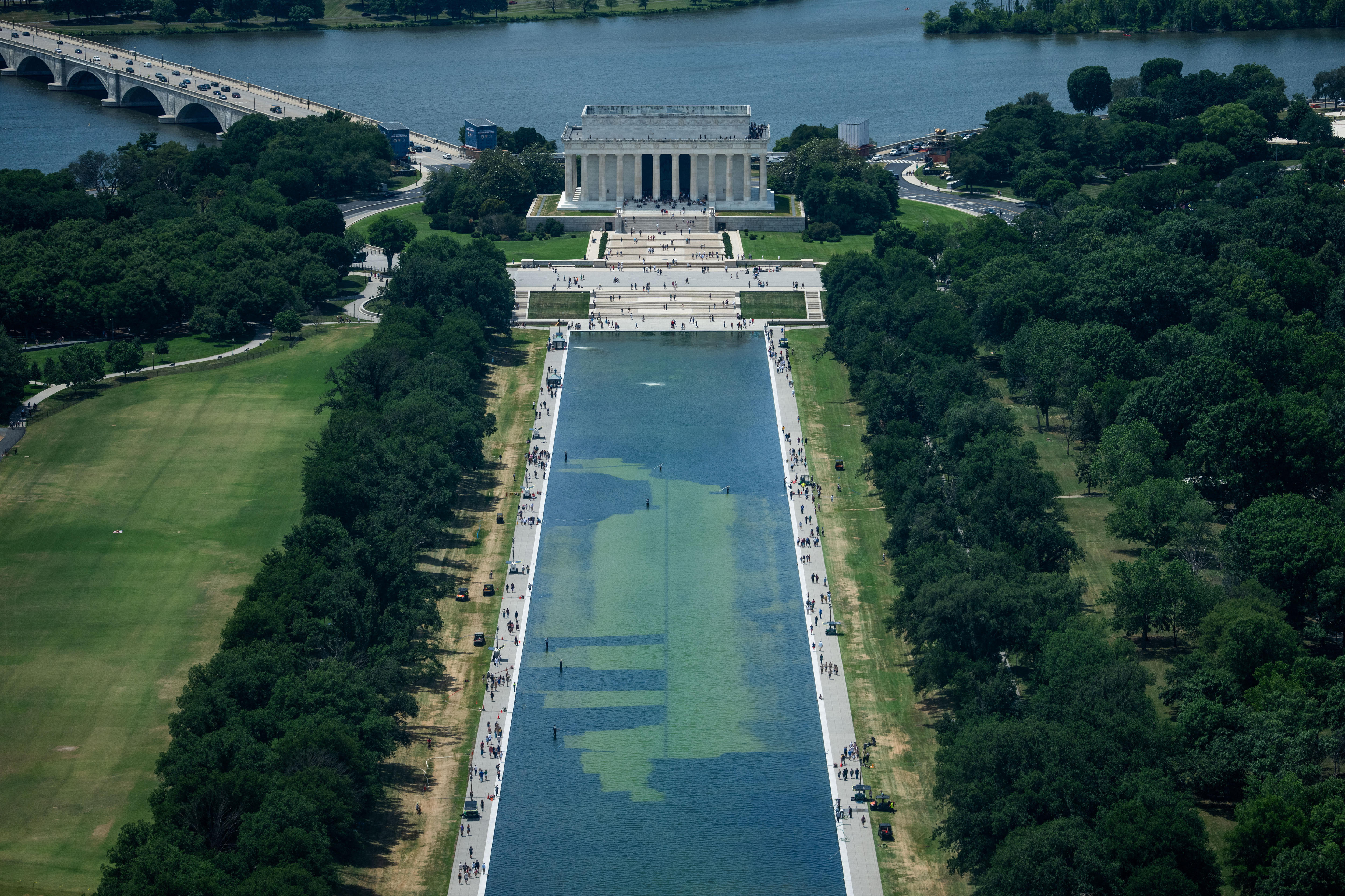 An aerial view of the Lincoln Memorial Reflecting Pool showing large patches of green