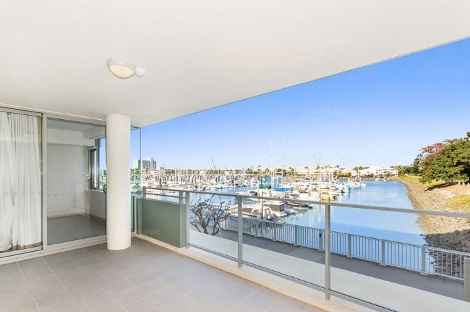 View of harbour from waterfront apartment in Townsville, which sold in 2019 for $239,000 less than its original price.