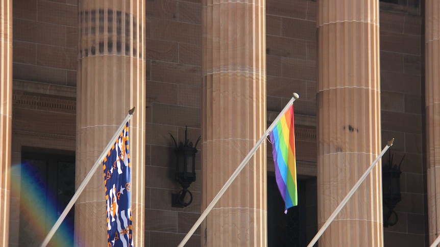 The rainbow flag, which is used by the LGBT community, hangs outside Brisbane City Council chambers.