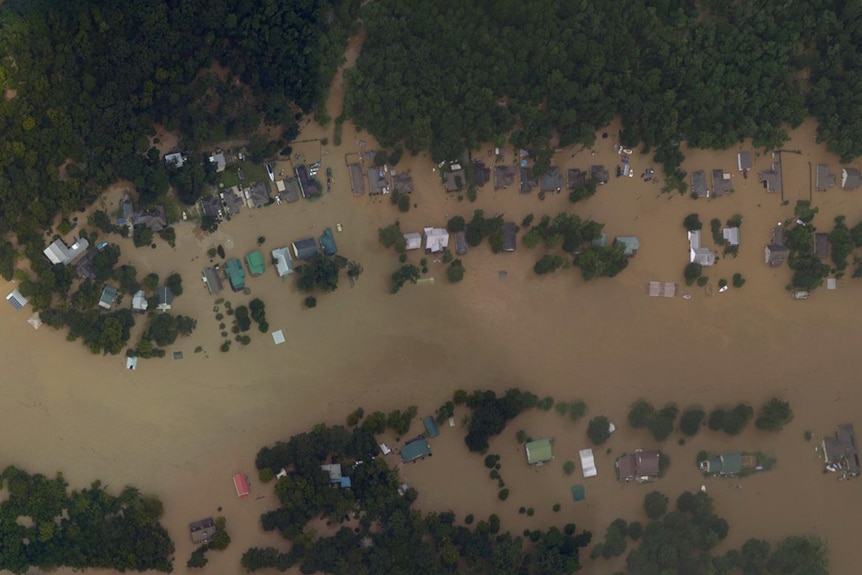 Satellite imagery shows waterfront homes in Summerfield, Louisiana, inundated by floods.