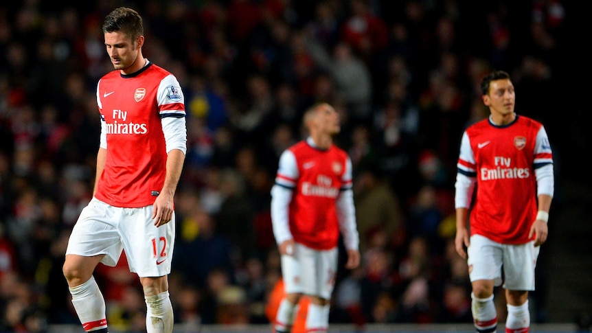 Arsenal's Olivier Giroud and Mesut Ozil prepare to restart after Everton's equaliser