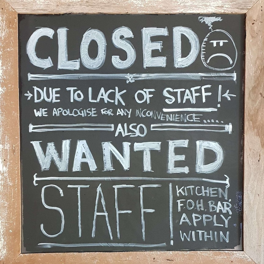 Sign on a blackboard searching for staff
