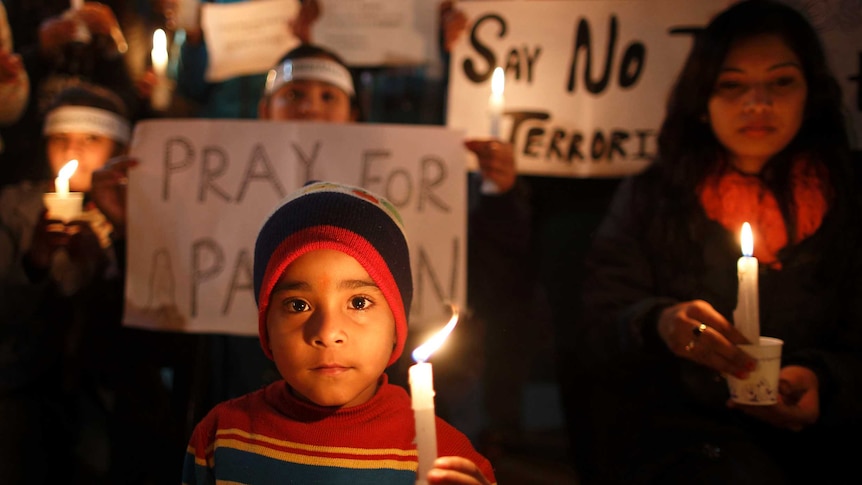 Pakistan has begun three days of mourning with candlelight vigils and funeral prayers.