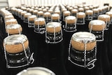Rows of capped sparkling wine