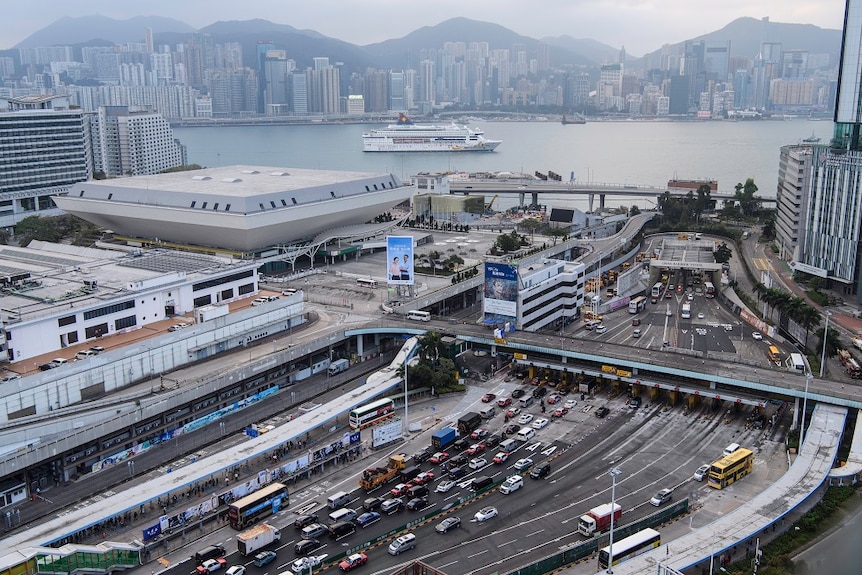 Tunnel in Hong Kong reopens, filled with lots of cars.