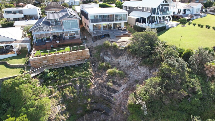 Houses on a cliff edge in the northern Illawarra region.