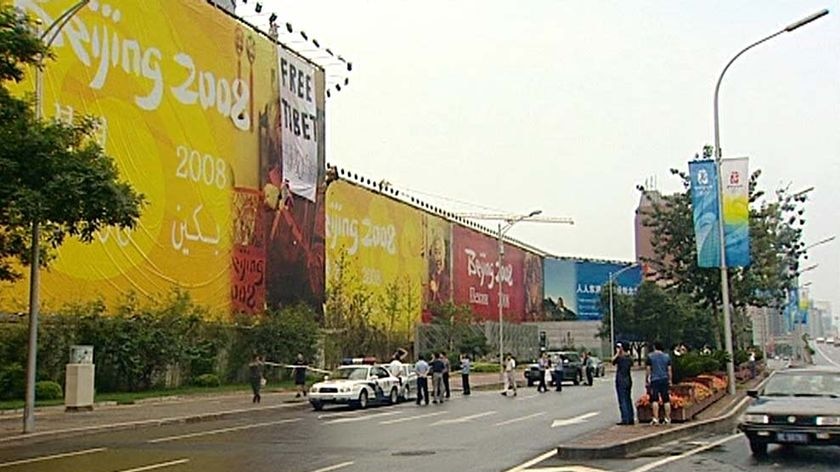 The protesters hung the free Tibet banner in central Beijing.