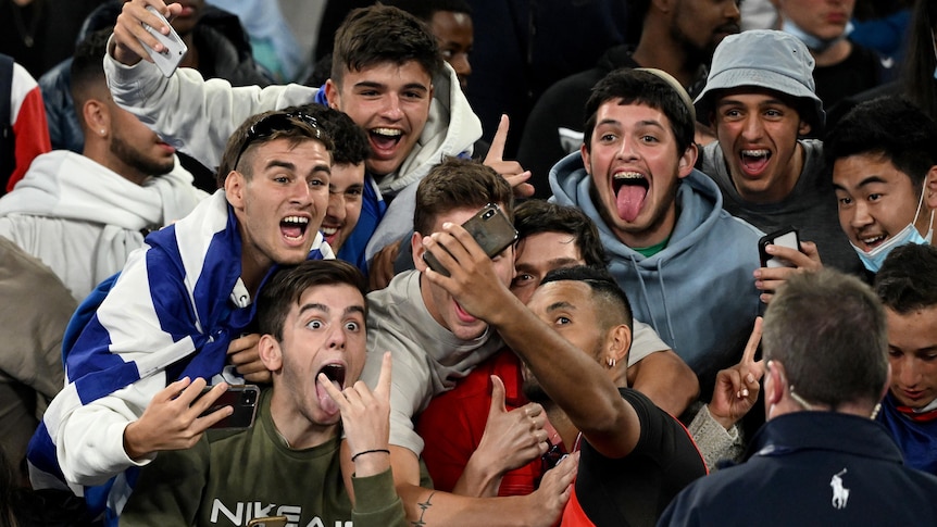 Australian tennis player Nick Kyrgios taking a seflie with fans at the Open