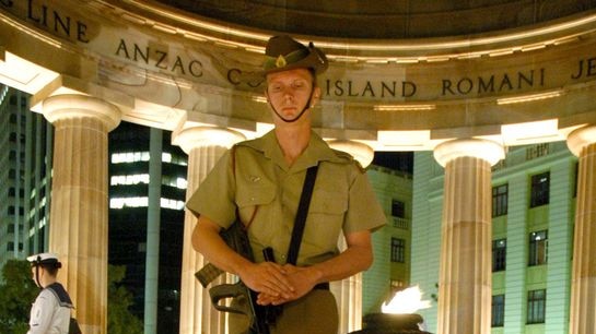 The Guard stands in the Cenotaph in Brisbane during the Anzac Day dawn service ceremony.