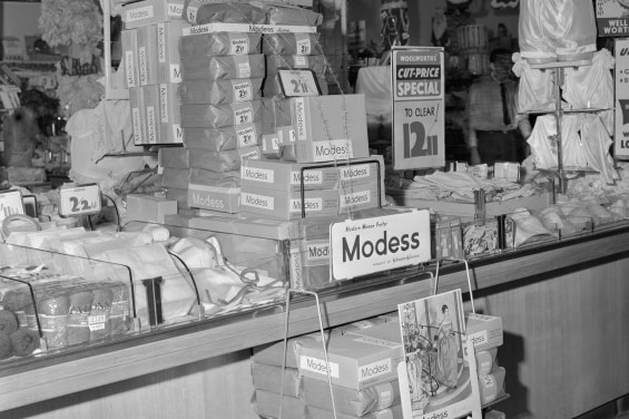 Photo of plain boxes of Modess sanitary napkins in Woolworths in the 1950s