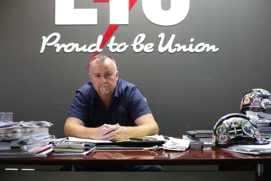 ETU state secretary Peter Ong sitting in his Brisbane office.