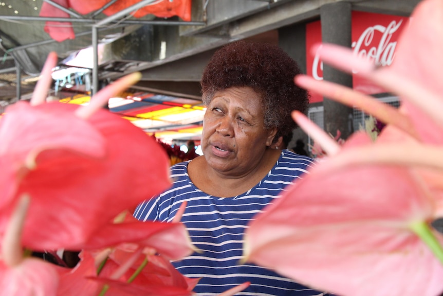 Fijian market vendor speaking.
