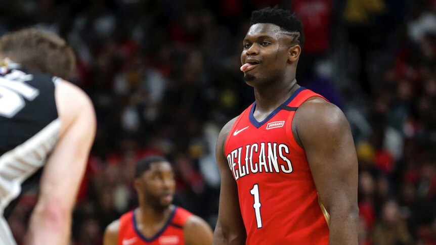 Zion Williamson sticks his tongue out as he plays his NBA debut against the San Antonio Spurs.