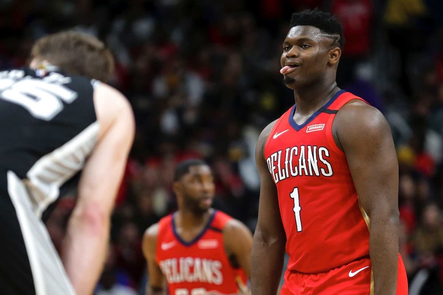 Zion Williamson sticks his tongue out as he plays his NBA debut against the San Antonio Spurs.