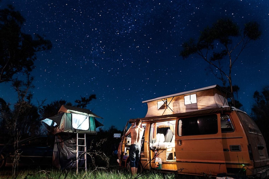 Campervan lit up at night