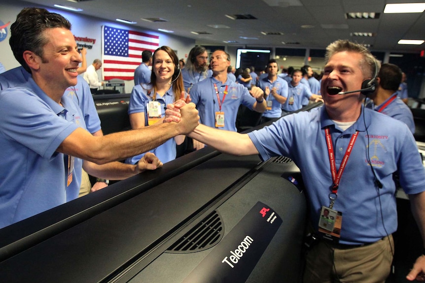 NASA workers celebrate successful Rover Mars landing