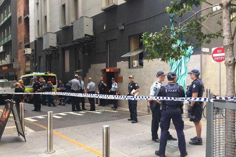Police officers outside scene of fatal shooting at Brisbane basement bar Brooklyn Standard Bar.