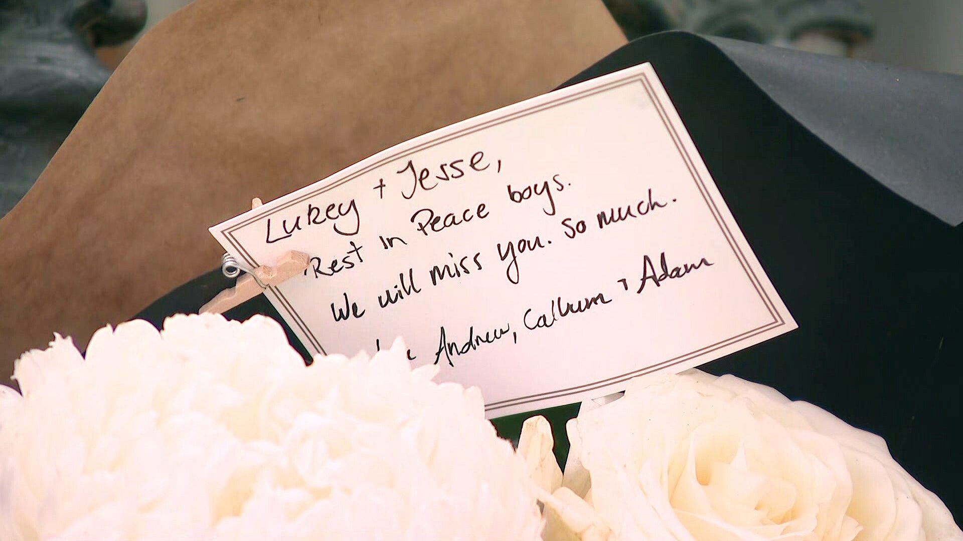 Flowers and messages of condolences for murder victims Luke Davies and Jesse Baird left outside a Paddington house