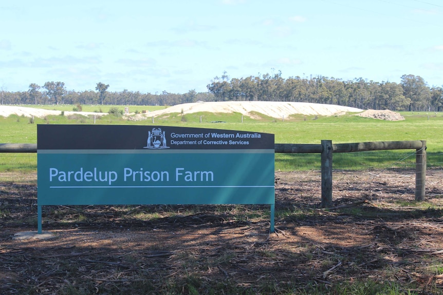 A sign at the entry to s prison farm.