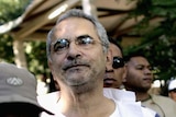 Jose Ramos-Horta stands in line at a polling station.