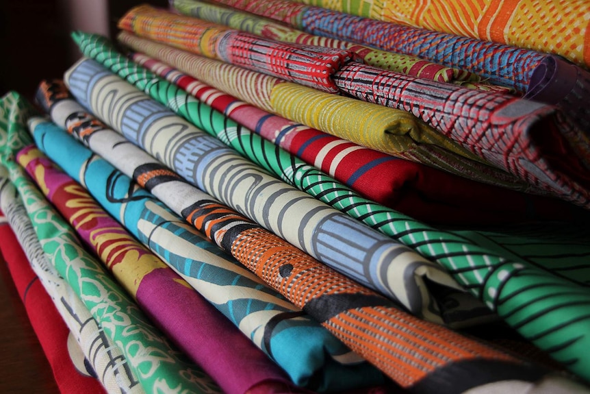 A photo of a pile of brightly coloured textiles from the Bábbarra Women's Centre.