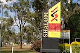 A colourful front sign outside leafy Shalom Christian College in Townsville.