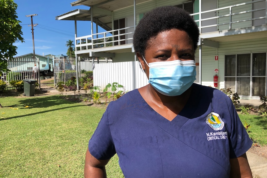 A woman wearing a face mask.