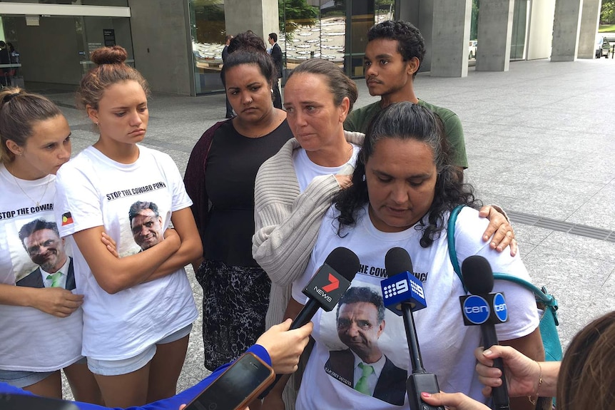 Sister Lavinia Duroux (far right) and family members speak outside court.