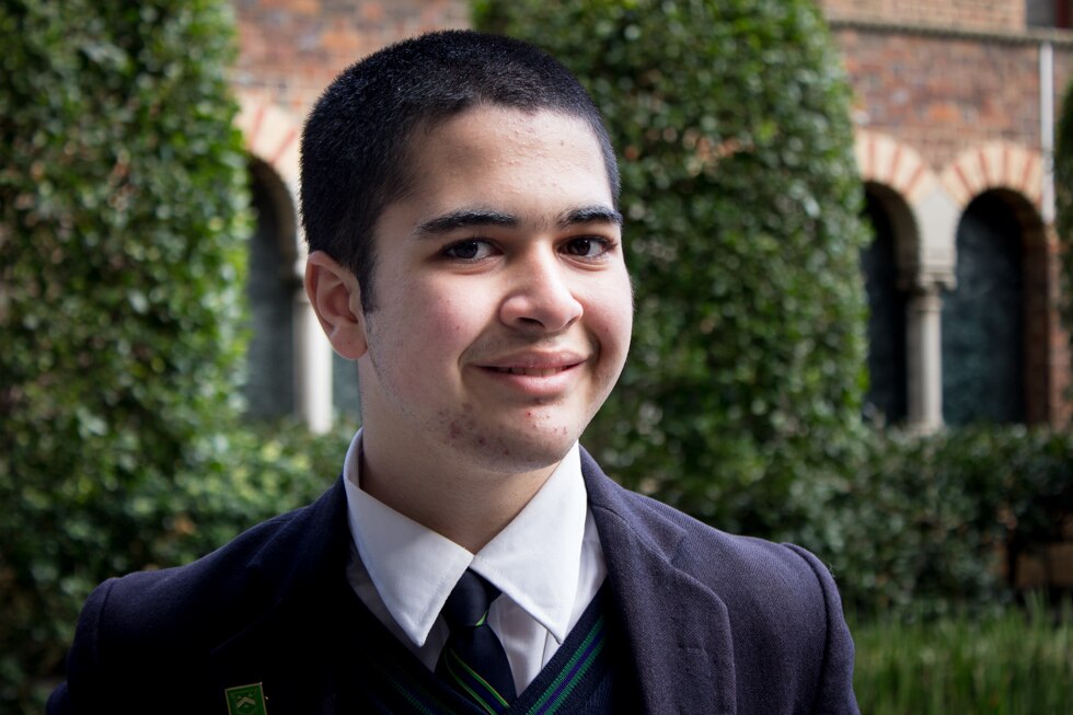 A teenage boy in school uniform