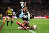 Cronulla Sharks winger Sione Katoa dives in to score a try against the Sydney Roosters.