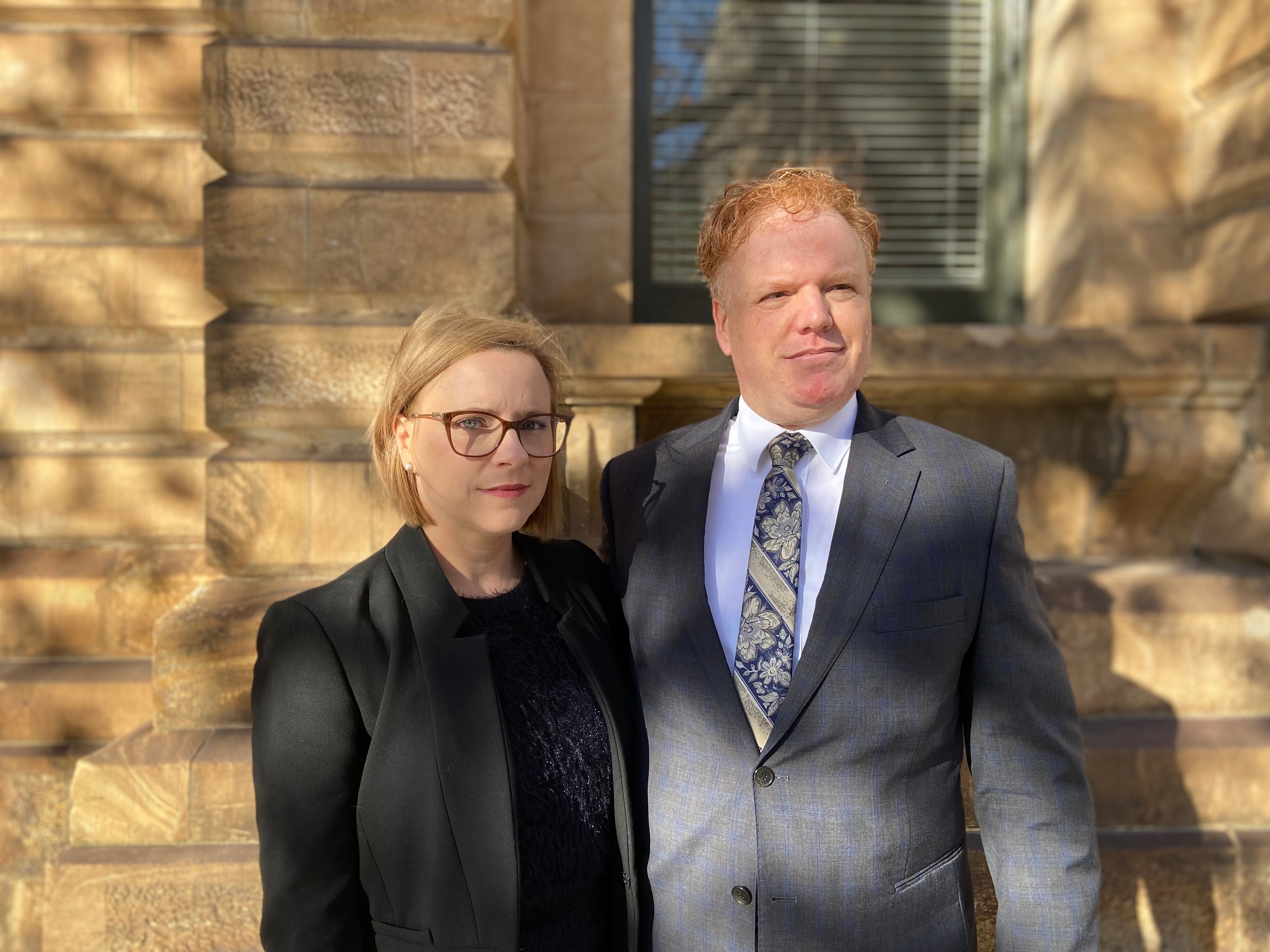 A wife and husband outside an Adelaide court.