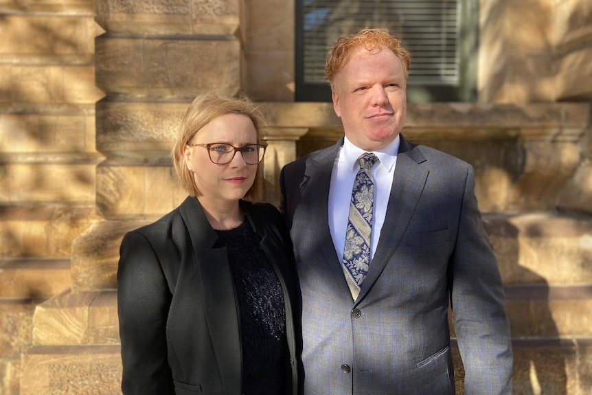A wife and husband outside an Adelaide court.