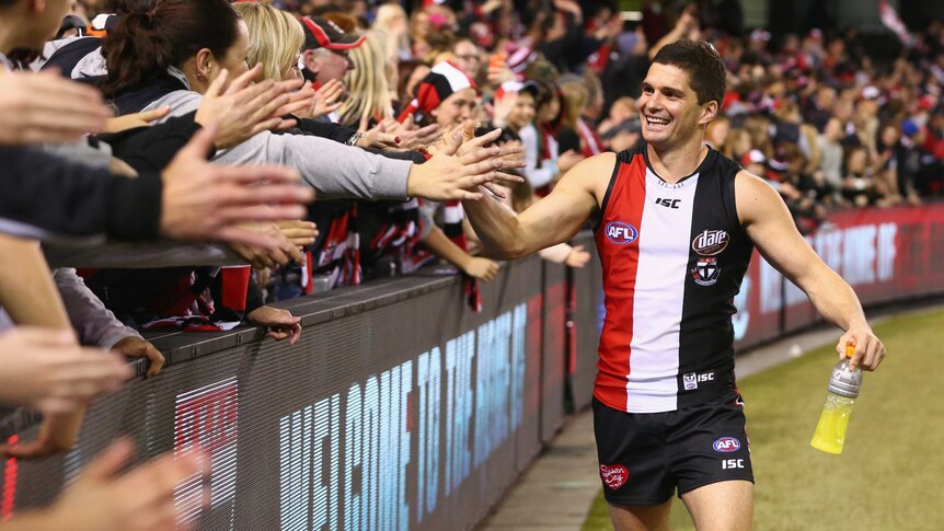 Leigh Montagna celebrates with fans after win over Demons