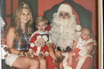 a mother and her two boys with santa