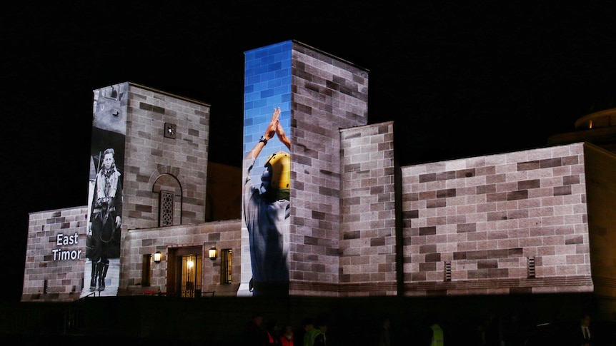 Projections on the War Memorial before dawn.