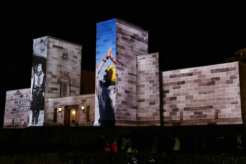 Projections on the War Memorial before dawn.