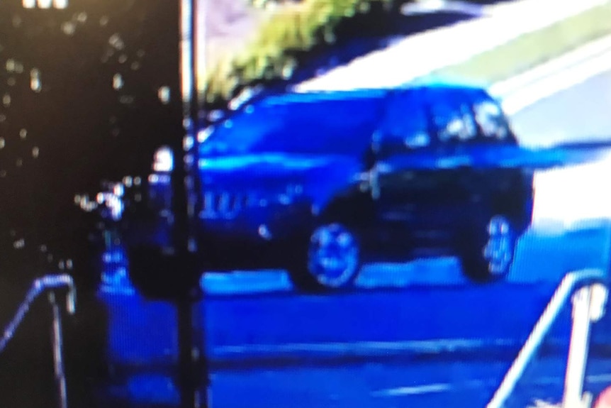 Blurry image of Jeep SUV