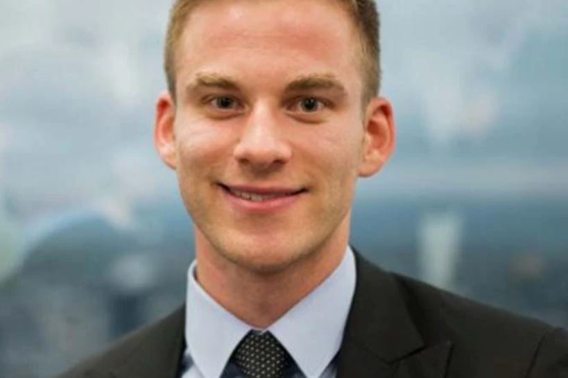 Headshot of man in his mid20s, blonde hair and smiling