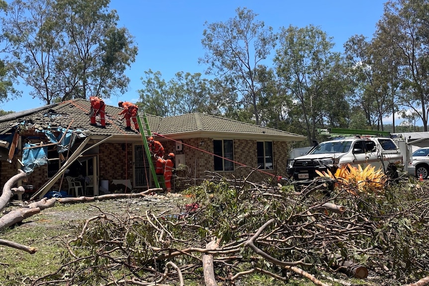 SES crews working to fix a roof in Jimboomba.