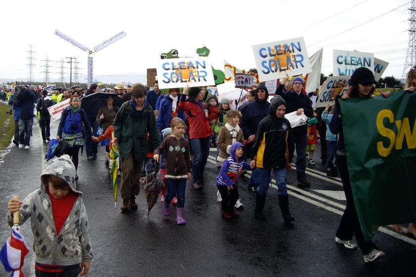 Climate change activists march outside the Hazelwood power station. (Peta Carlyon: ABC News)