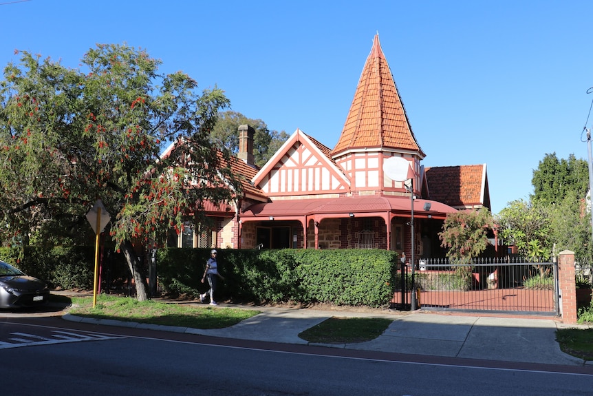 The exterior of a beautiful, old house in Northbridge, surrounded by trees.