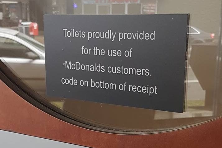 Signage on bathroom door at a Sunshine Coast McDonald's store
