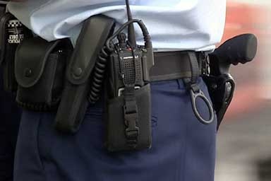 Police holster with radio attached.
