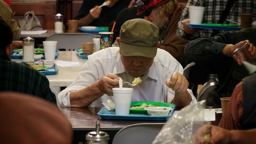 Homeless people come for food and drink at the Exodus Foundation.